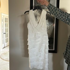 Cocktail dress. White with pearl trimming, sleeveless. Almost new.